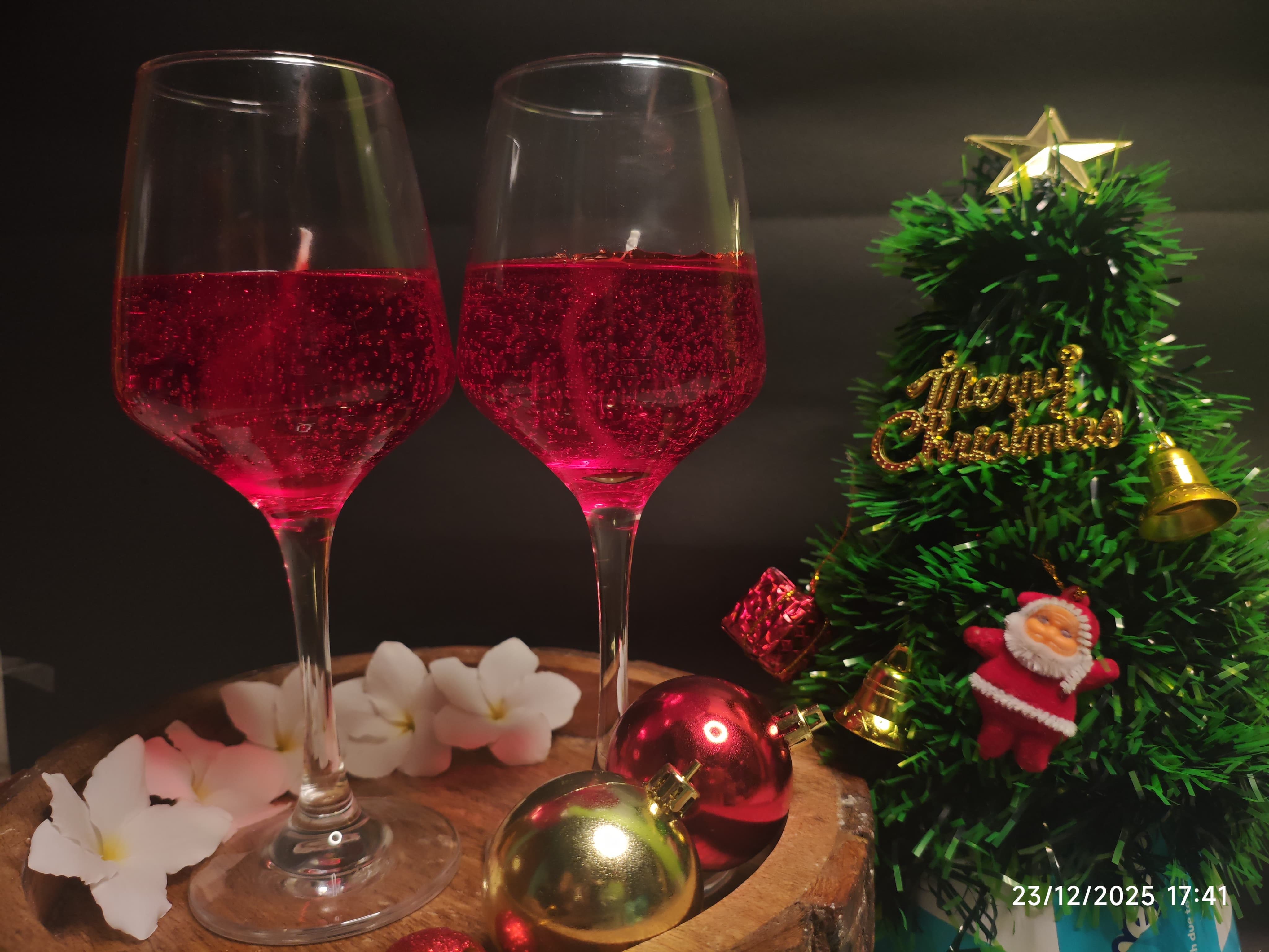 Red wine glass candle styling with Christmas decor